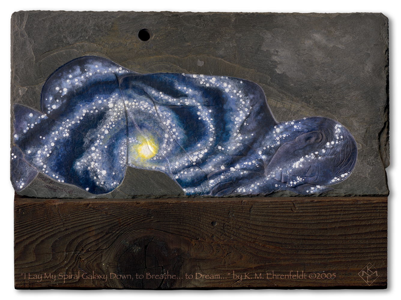 A woman laying on her side etched into weathered slate is painted as a spiral galaxy. The slate rests atop a recycled barn wood post. The knot in the wood at the base lines up with the center light on the woman and the black velvet void of potential above.