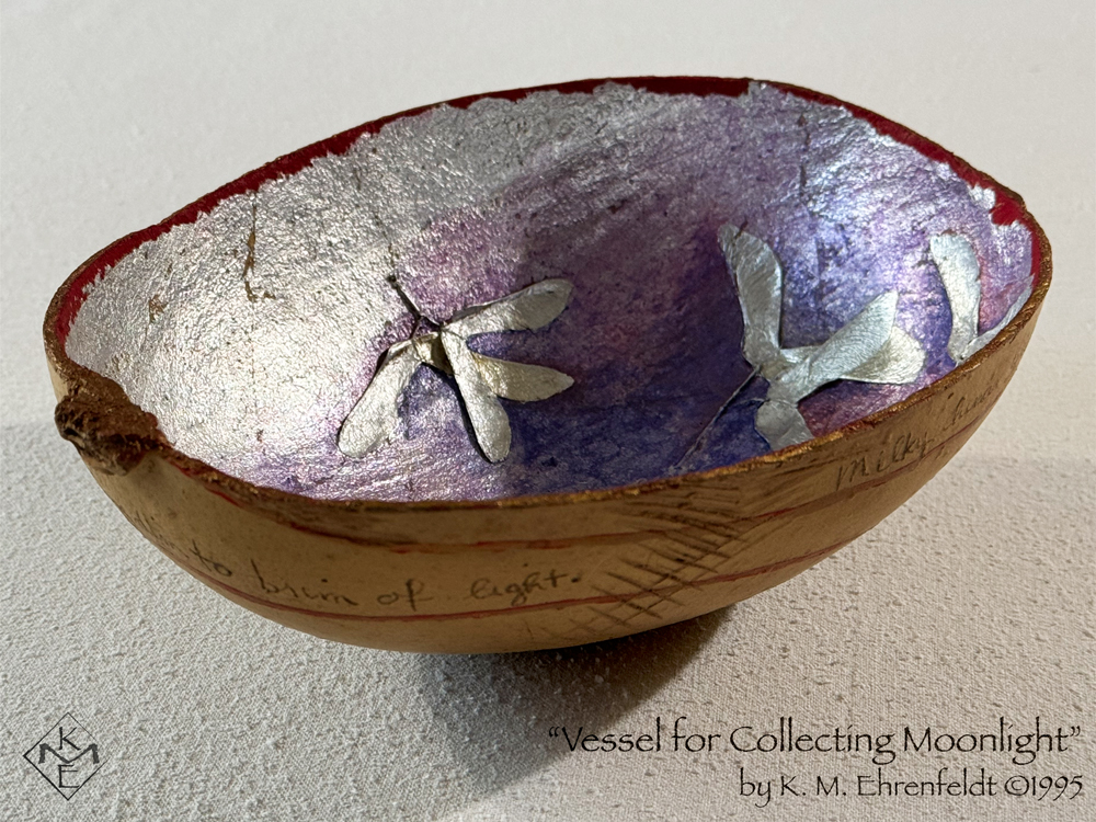 A side view of the whole vessel is visible. The concave silver surface has a translucent blue-violet wash in a few areas as well as a faint magenta wash at some of the upper edges. The rim is stained gold and vivid red. Interlaid inside the vessel are groupings of silver maple seed pods that look like outspread wings. On the outer surface of the vessel is the raw amber gourd skin, painted with a red line that spirals downward around from the stem of the gourd. The words, "...brim of light" are visible.